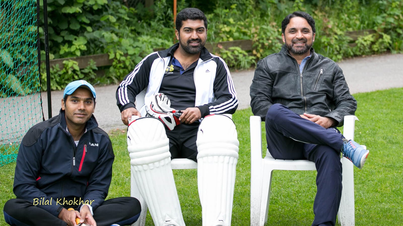 Omair with close friends, relaxing by the ground between games